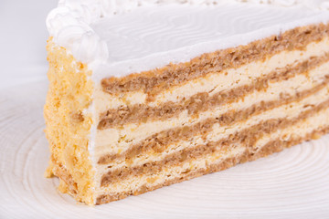 Cut cakes with different fillings, cows and cream, berries and chocolate
