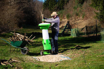Garden shredder or wood chipper for shredding tree or shrub cuttings.
