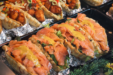 Smoked salmon sandwiches with mustard sauce on top