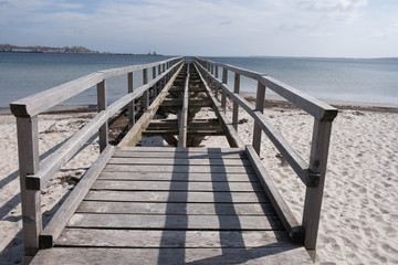 broken wooden pier on the european sea