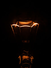 macro detail of light bulb with dark background