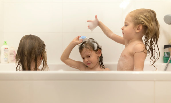 Happy children girls are bathing