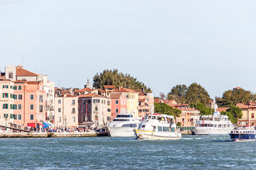 Fototapeta premium Pleasure yachts near the promenade in old town of Venice, Italy.