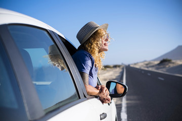 Happy freedom concept with beautiful lonely traveler adult caucasian woman enjoy the trip lifestyle...