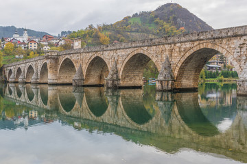Fototapeta premium Visegrad, Bosnia & Herzegovina - the Mehmed Paša Sokolovic Bridge is one of the main landmarks in the country, and Visegrad one of the pearls of the Balkans