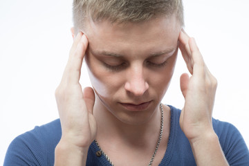 A young man having a headache