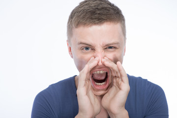 Attractive young man shouting