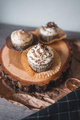 Poppy seed cupcakes with lemon curd filling and whipped cream with cinnamon
