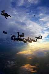 skydiving big group of people at sunset