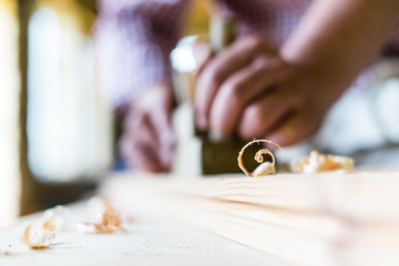 Hands working planer