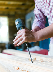 gouge wood chisel carpenter tool hammer in hand working