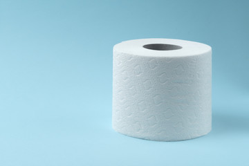 Toilet paper on blue background. Toilet paper roll tissue. Health care concept. Coronavirus panic concept. People are stocking up toilet paper for home quarantine from coronavirus