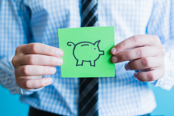 Hands holding piggy bank