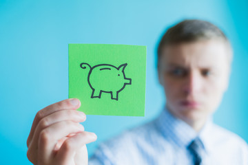 Hands holding piggy bank