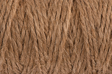 Closeup of a thin hemp rope. Natural material. Copy space for your text.