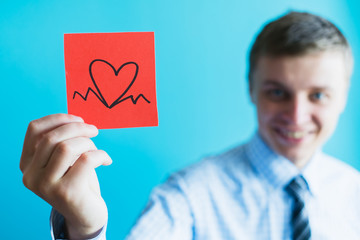 Man holding icon cardiogram