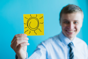 man hands holding the sun