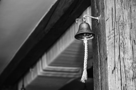 Metal, Brass Bell Hangs In An Old-style Room