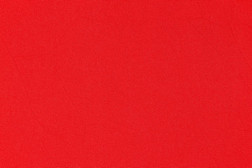 Red, scarlet background. Red, scarlet Synthetic fabric texture, background. Red, scarlet fabric.