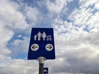 Close up view of IKEA blue sign for family car parking on white clouds background. Europe. Sweden. Uppsala. 
