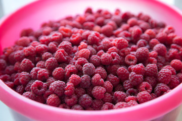 Raspberry berries in a bucket. Top view.