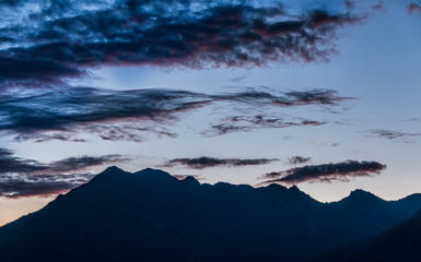 Silhouette of mountain range at sunset