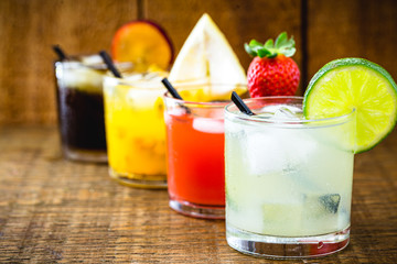 Brazilian drink known as caipirinha, made from cachaça with fruits. Watermelon, strawberry, lemon, peach and plum flavors