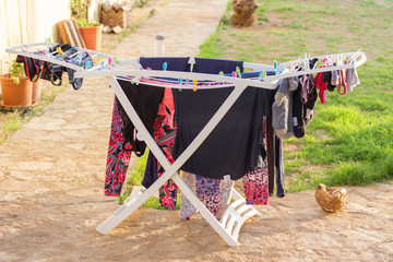 Air drying laundry on summer day in yard - 340023375