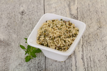 Peeled hemp seeds in the bowl