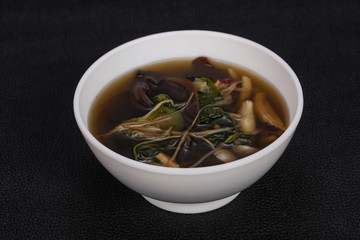 Thai style soup with meat and mushrooms