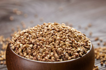 Buckwheat groats (hulled seeds) in wooden bowl