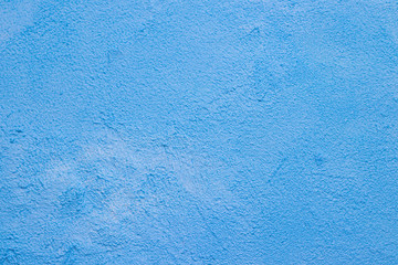 The texture is a patched wall . Blue texture of the wall. Abstract background. .