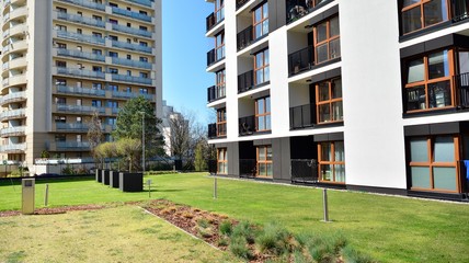Obraz na płótnie Canvas Modern apartment building in sunny day with a blue sky. Facade of a modern apartment.