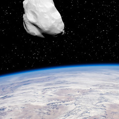 Asteroid above the earth. Elements of this image furnished by NASA.