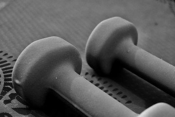 Dumbbells on exercise matt 