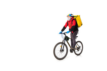 Obraz premium Too much orders. Contacless delivery service during quarantine. Man delivers food during isolation, wearing gloves and face mask. Taking pizza on bike isolated on white background. Safety. Hurrying up