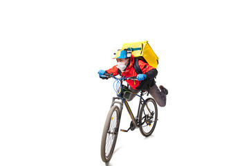 Fototapeta premium Too much orders. Contacless delivery service during quarantine. Man delivers food during isolation, wearing gloves and face mask. Taking pizza on bike isolated on white background. Safety. Hurrying up