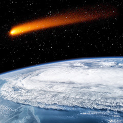 Comet over the earth. Meteor rain. The elements of this image furnished by NASA.