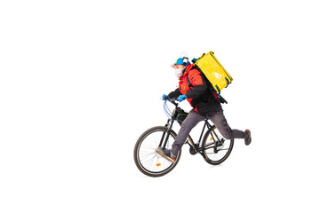 Too much orders. Contacless delivery service during quarantine. Man delivers food during isolation, wearing gloves and face mask. Taking pizza on bike isolated on white background. Safety. Hurrying up