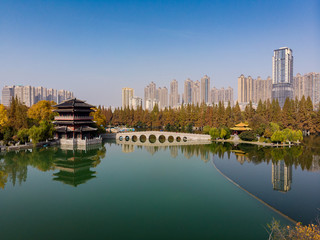 Panoramic view of the lake with a typical chinese temple and the new city above