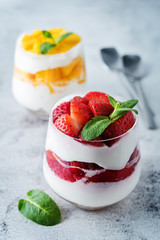 Greek yogurt strawberry and mango parfait in glasses