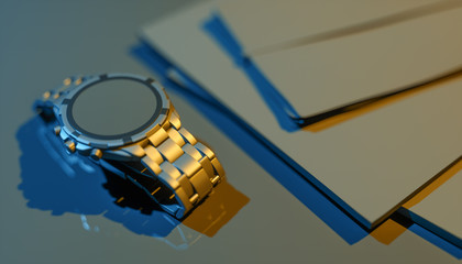 wristwatch and notebook on a black background in blue and yellow lighting