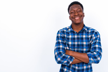 Young handsome African man against white background