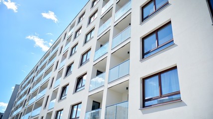 Modern apartment buildings on a sunny day with a blue sky. Facade of a modern apartment building