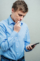 man looking scared into the mobile phone