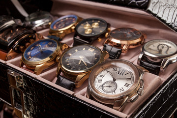 storage box with collection of men wrist watches - obrazy, fototapety, plakaty