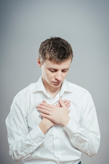 Man with his hand on heart taking an oath