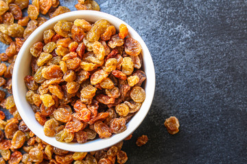 raisins, delicious dried grapes (fresh fruit vitamins) menu concept background. top view. copy space for text keto or paleo diet