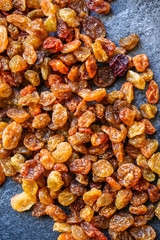 raisins, delicious dried grapes (fresh fruit vitamins) menu concept background. top view. copy space for text keto or paleo diet
