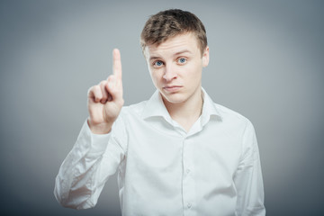 man pointing up with his index finger